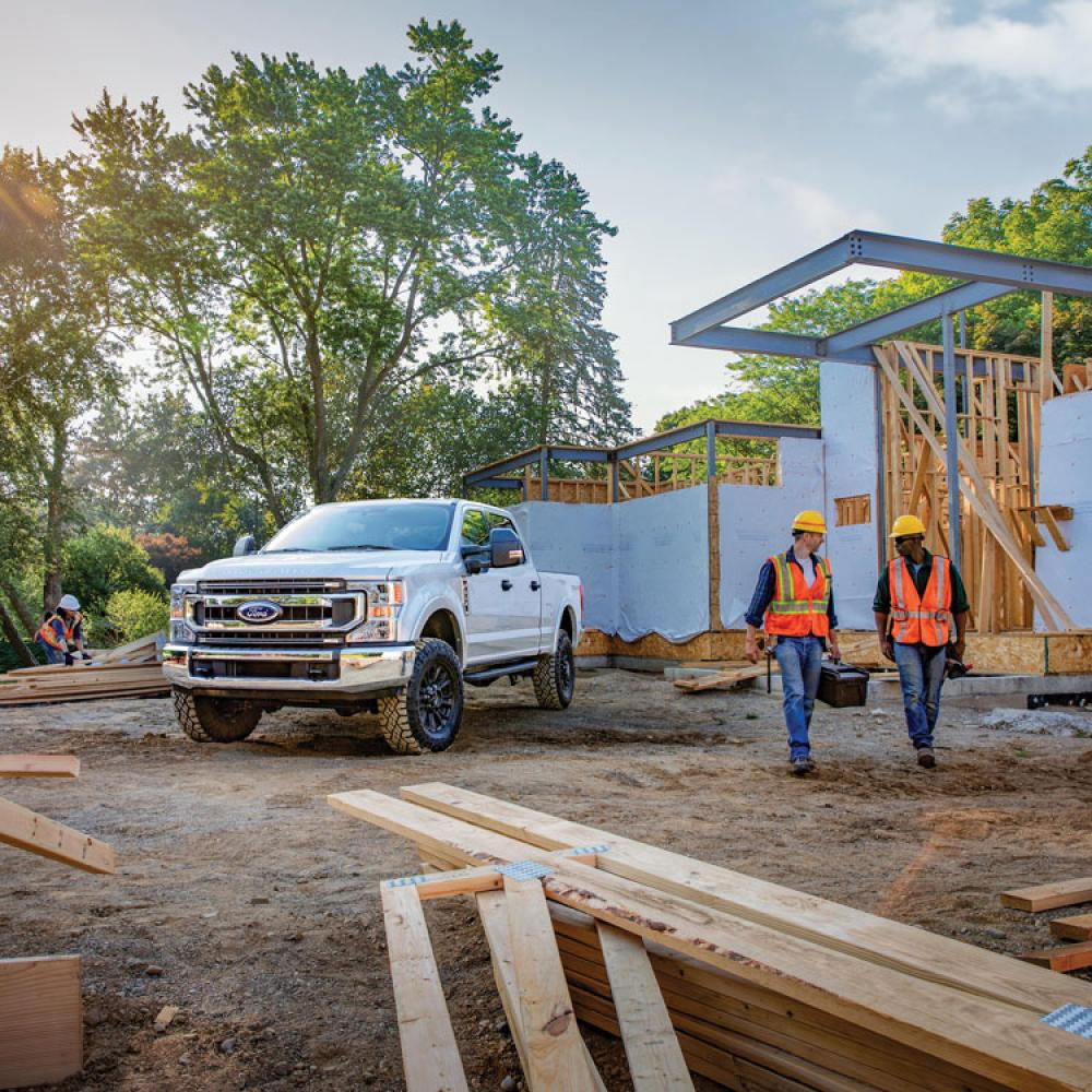 A Ford Super Duty Truck in a construction site with construction workers